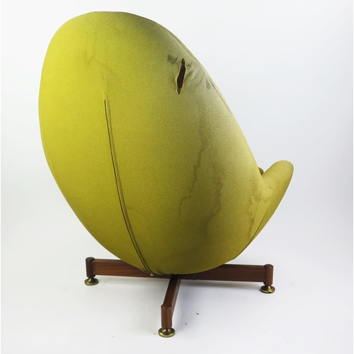 1075 - AV Greaves & Thomas egg swivel chair, with pale yellow loose cover on an X-frame base.