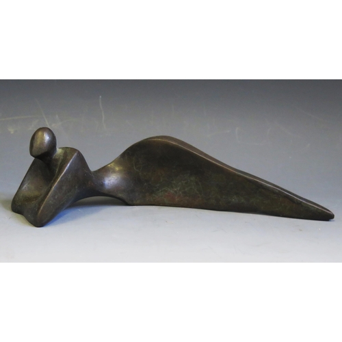 1089 - A Mid to late 20th century abstract bronze lying  figure with raised shoulders, unsigned, 24cm long.