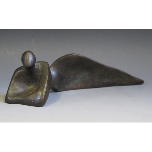 1089 - A Mid to late 20th century abstract bronze lying  figure with raised shoulders, unsigned, 24cm long.