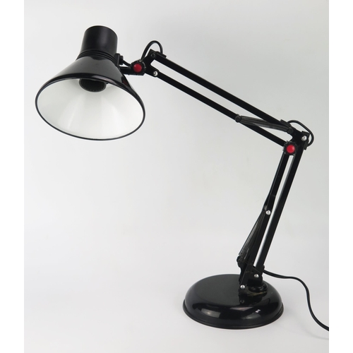 1109 - A 1970's period model 50728 angle-poise lamp in black, on a weighted circular base.