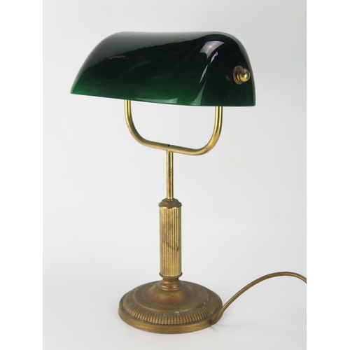 1110 - An anodised metal banker's table lamp with green glass shade on a reeded column and circular weighte... 