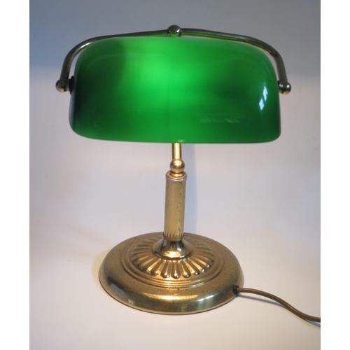 1111 - A lacquered brass banker's table lamp with green glass shade, on spiral twist column and weighted ci... 