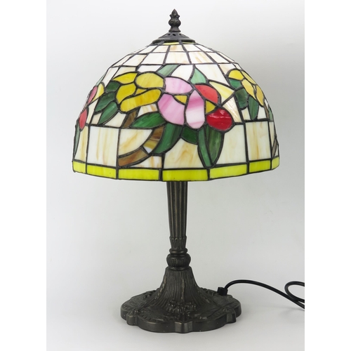 1113 - A Tiffany style table lamp, with leaded polychrome resin shade, on a fluted column and shaped dragon... 