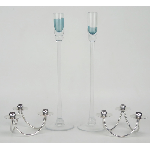 1117 - A pair of Danish stainless steel three light candlesticks, together with a pair of Scandinavian glas... 