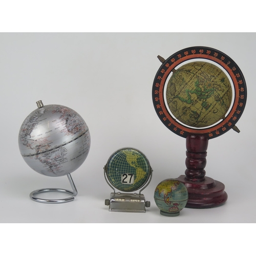 1119 - A lithographed tinplate tape measure in the form of a terrestrial globe, 4.5cm diameter, together wi... 