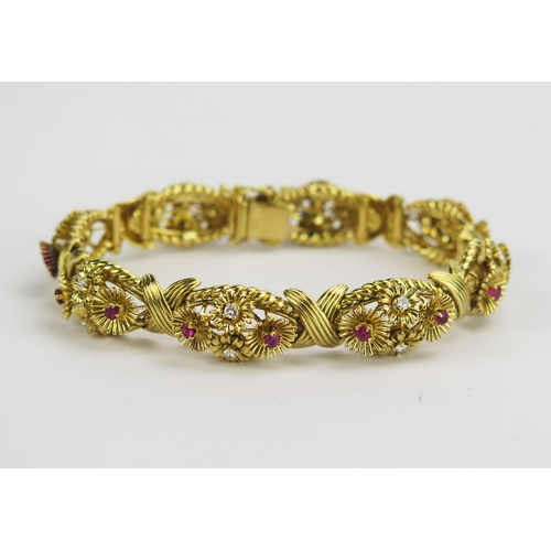 A 1950's 18ct Gold, Ruby and Diamond Bracelet decorated with eight panels having stones in arranged in articulated swivelling flower heads, 7.25" (18.5cm), 12.2mm wide, London 1959, maker BRLd for Ben Rosenfeld, 51.88g

Ben Rosenfeld was a British jewellery designer based in Hatton Garden. His jewellery design and production started around 1959, and he gained an international following throughout the 1960s and 70s for his fine jewellery designs.

Operating in the post-war period, Rosenfeld relies heavily on gold in his designs, with plenty of bold, heavy and bright designs. Ben was one of the few Hatton Garden jewellers of the time to attain a worldwide reputation, and he continued to work until 1987.

Today, one of his designs for a bracelet can be seen in the Victoria & Albert Museum. Pieces by Ben Rosenfeld are all signed with his maker's mark 'BRLd' and have a significant following of collectors.