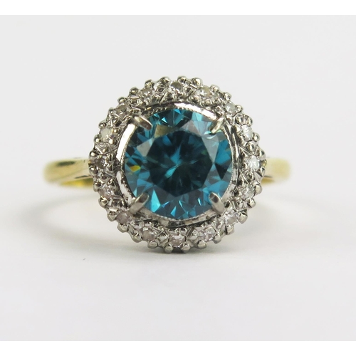 113 - An 18ct Gold, Blue Zircon and Diamond Cluster Ring, 7.54mm principal platinum claw set stone, 12.5mm... 