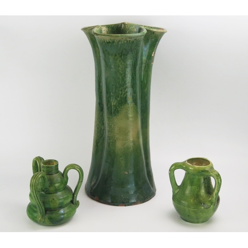 1130 - A large Farnham pottery vase of cylindrical trefoil outline, with variegated green glaze, 44cm high,... 