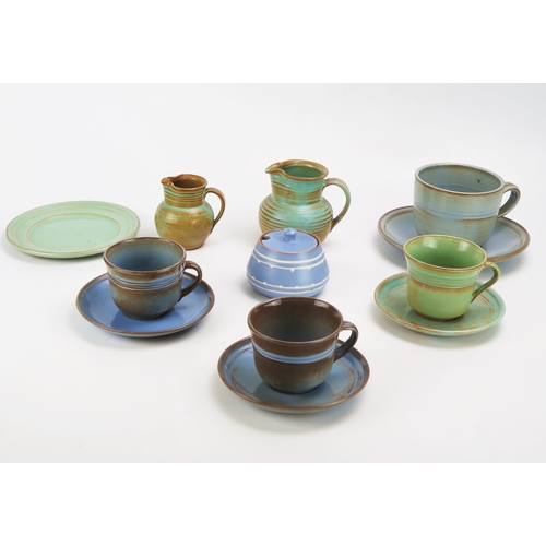 1132 - A collection of Prinknash pottery teawares, includes cups, saucers, cream jugs and preserve pot and ... 