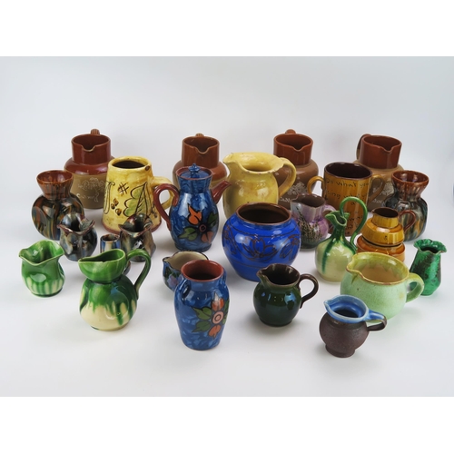 1148 - A collection of Denby Cadbury's Chocolate  jugs, together with other vases, cream jugs, sugar basins... 