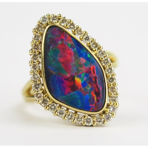 115 - A 14K Gold, Black Fire Opal and Diamond Ring, 16.4x9.6mm doublet opal, 21.8x14.9mm head, size M.75, ... 