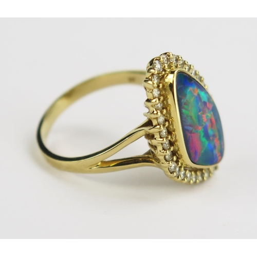 115 - A 14K Gold, Black Fire Opal and Diamond Ring, 16.4x9.6mm doublet opal, 21.8x14.9mm head, size M.75, ... 