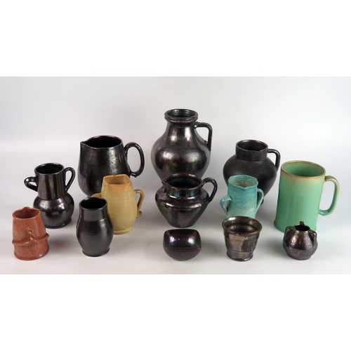 1152 - A collection of Dicker pottery wares, including tumbler, vases, jugs and mugs,