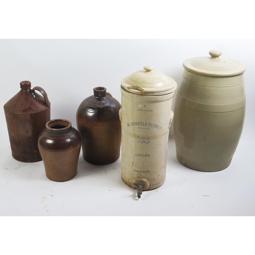 1153 - A large six gallon stoneware barrel and cover, 58cm high, a  stoneware water filter, 54cm high, a/f ... 