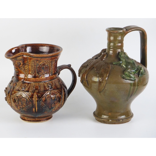 1160 - An oxide glazed jug possibly by Agnete Hoy, 20cm high together with a jug possibly by Farnham potter... 