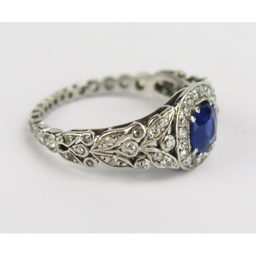 117 - A Pretty Sapphire and Old Cut Diamond Ring with pierced foliate shoulders and diamond set around the... 