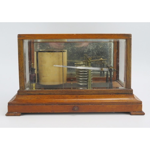 1183 - Yeates & Son, Dublin, an oak cased barograph, with seven tier vacuum and single recording arm, with ... 