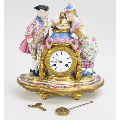 1186 - A 19th century French porcelain figural mantel clock, the urn-shaped case flanked by a gallant and l... 