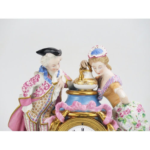 1186 - A 19th century French porcelain figural mantel clock, the urn-shaped case flanked by a gallant and l... 