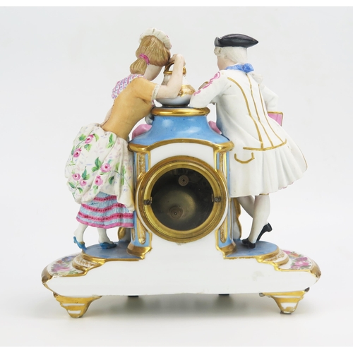 1186 - A 19th century French porcelain figural mantel clock, the urn-shaped case flanked by a gallant and l... 