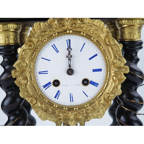 1187 - A 19th century French ebonised cut brass and red tortoiseshell inlaid Portico clock, the 9cm white c... 