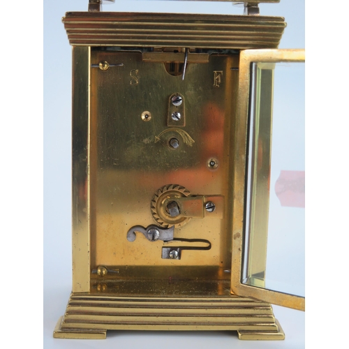 1191 - A lacquered brass carriage timepiece, with 6cm ivorine Arabic dial, the movement with lever platform... 