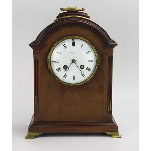 1193 - W R Bullen, Norwich, a mahogany Georgian style bracket clock, of arched outline with 11cm Roman dial... 