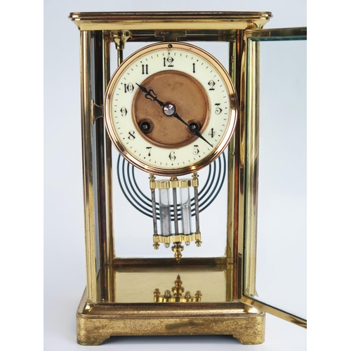 1194 - A lacquered brass four-glass mantel clock of rectangular outline, the circular movement with 9cm Ara... 