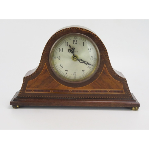 1196 - An Edwardian mahogany and chequered strung mantel clock of arched outline with 8cm silvered Arabic d... 