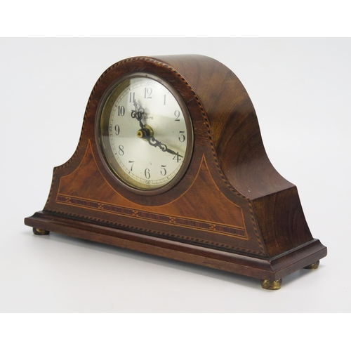 1196 - An Edwardian mahogany and chequered strung mantel clock of arched outline with 8cm silvered Arabic d... 