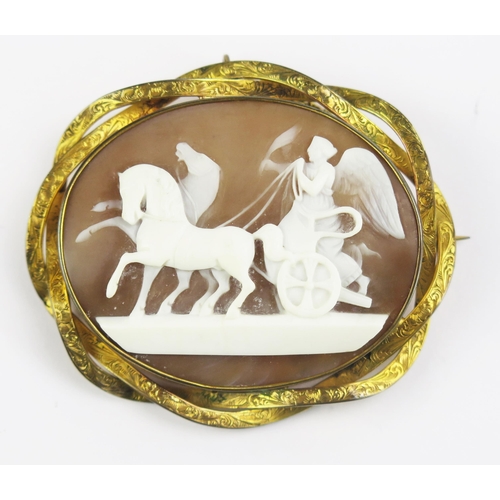 121 - A Victorian Shell Cameo Brooch in a yellow metal mount decorated with Victory riding a chariot, 57.9... 