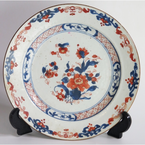 1221 - A late 19th century Chinese Imari porcelain plate, with central floral spray and stylised scroll bor... 