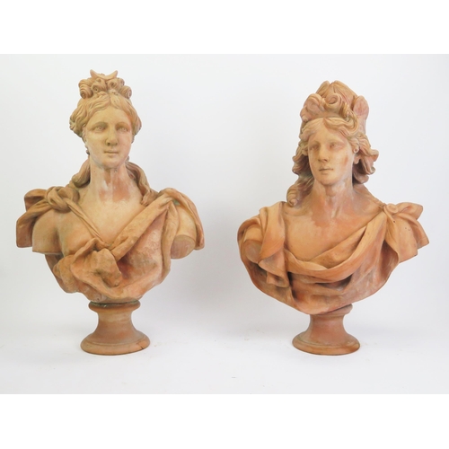 1230 - A pair of reproduction monumental terracotta busts, symbolising Diana and Apollo, raised on socle ba... 