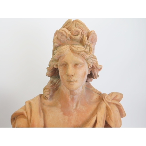 1230 - A pair of reproduction monumental terracotta busts, symbolising Diana and Apollo, raised on socle ba... 