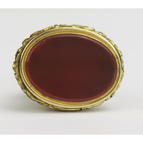 125 - An Antique Gilt Metal and Carnelian Seal Ring, 23.8x18.2mm head, 10g