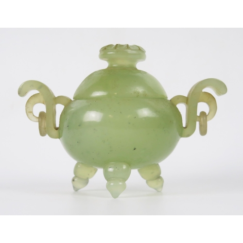 1258 - A Chinese jade carved circular tripod censer and cover, with flowerhead finial, with ring handles to... 