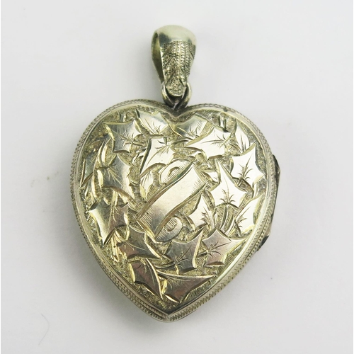 129 - A Victorian Precious White Metal Heart Shaped Locket Pendant with chased foliate decoration, 41.7mm ... 