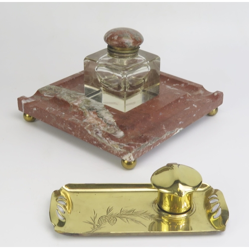 1290 - An Art Nouveau period brass ink well 18cm long, together with a marble and clear glass inkwell 19.5c... 