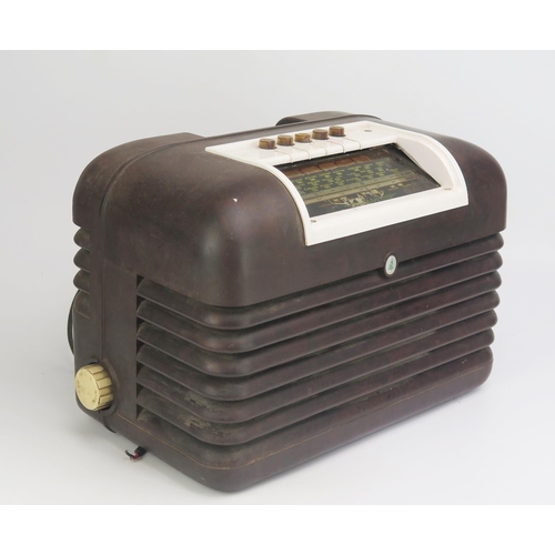 1292 - A Bush mains radio contained in a brown Bakelite case, 34cm wide, 23cm high.