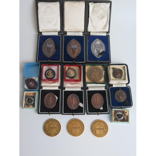 1295 - A collection of bronze and other medallions and awards, most boxed or cased. (a lot)