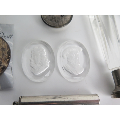 1303 - A pair of oval glass intaglio's, a glass handled seal, a white metal figure of cupid, bone handles a... 