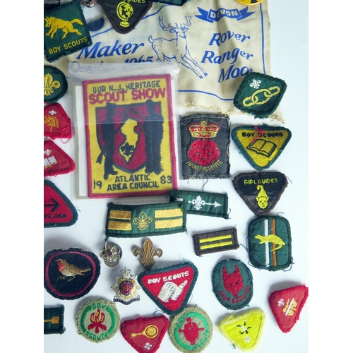 1309 - A collection of Boy Scout cloth badges, leather belt,