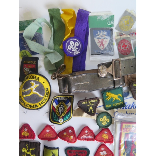 1309 - A collection of Boy Scout cloth badges, leather belt,