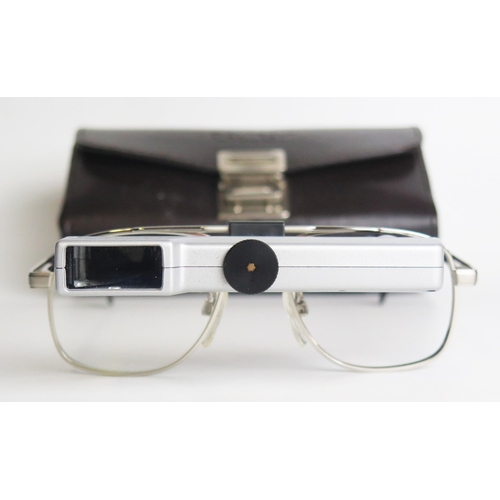 1313 - A pair of Ocutech VES magnifying glasses, with stitched leather case.