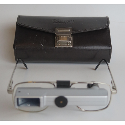 1313 - A pair of Ocutech VES magnifying glasses, with stitched leather case.