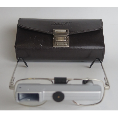 1313 - A pair of Ocutech VES magnifying glasses, with stitched leather case.