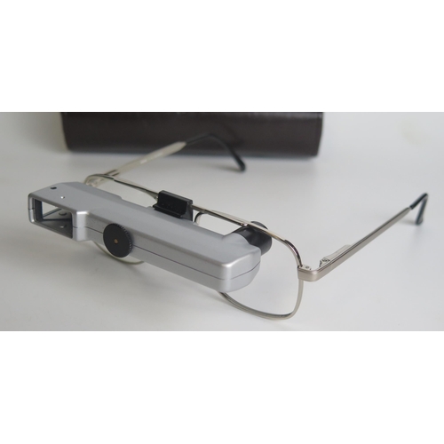 1313 - A pair of Ocutech VES magnifying glasses, with stitched leather case.