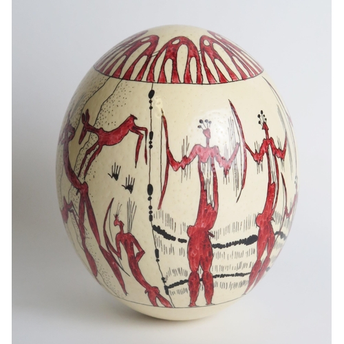 1316 - An ostrich egg, decorated with painted tribal warriors and hunting scenes,