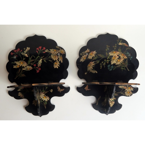 1318 - A pair of Victorian papier mache folding wall brackets, with floral decoration to a black ground, th... 