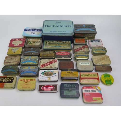 1323 - A collection of assorted pastille tins by various companies, a metal First aid tin etc.